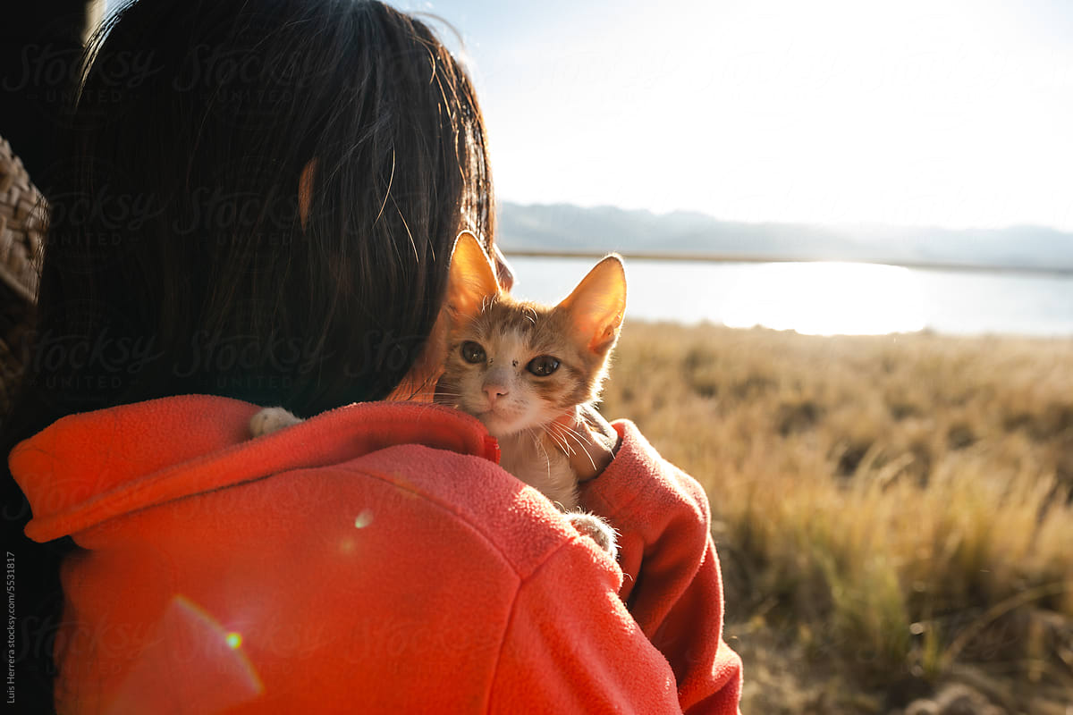 woman with her cat enjoy outdoors