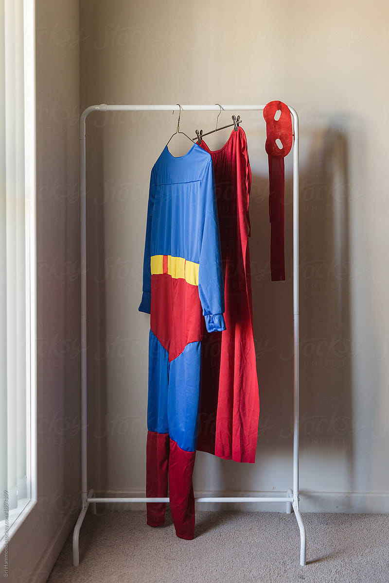 superhero costume hanging on clothes rack