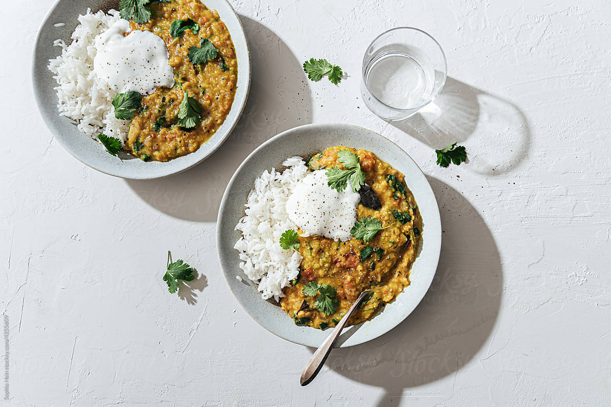 Lentil dal with spinach, tomatoes, rice and yogurt