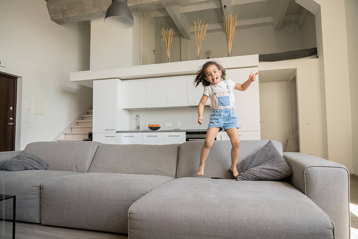 Child Jumping On the Sofa