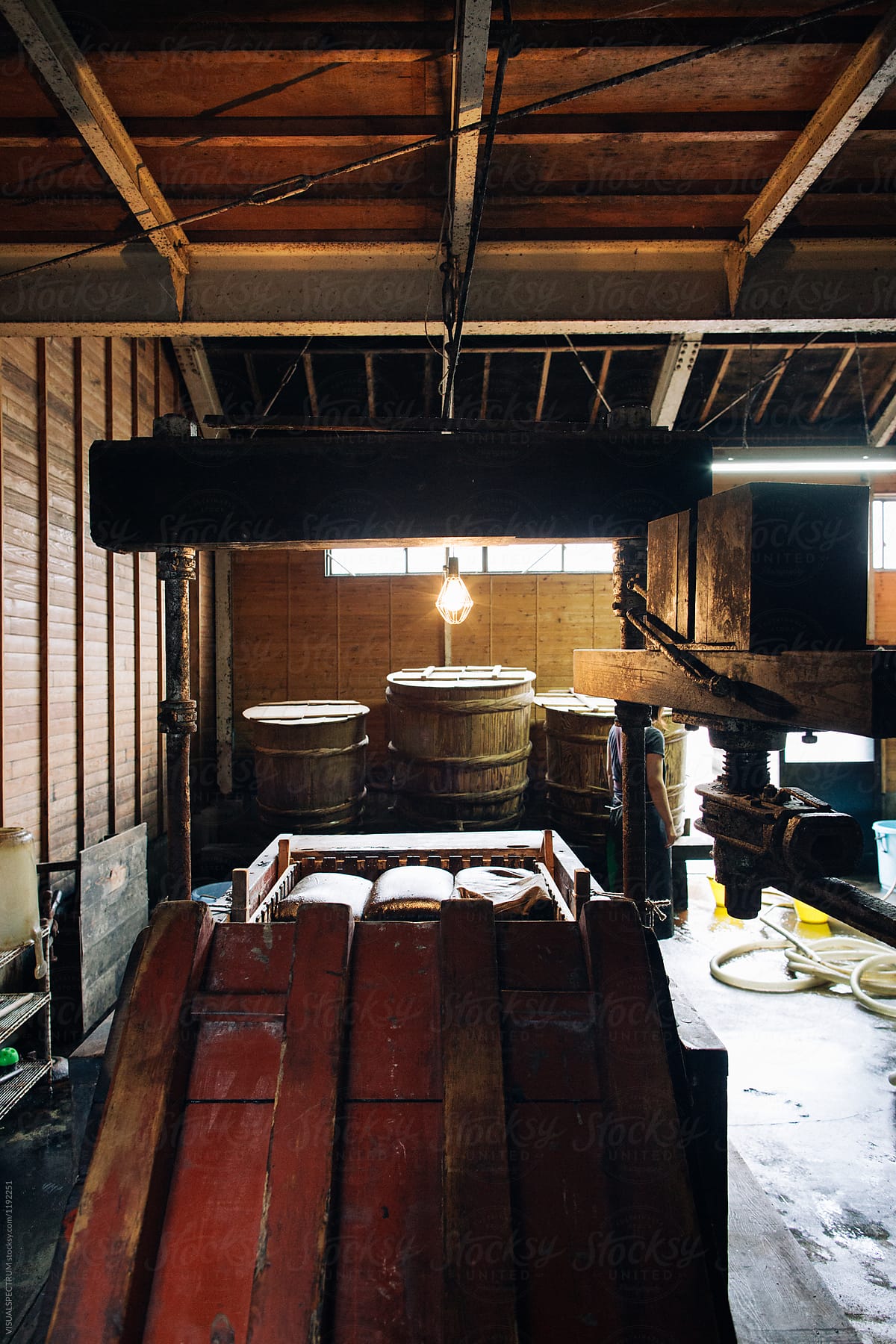 Traditional Soy Sauce Making - Wooden Press With Barrels in Background