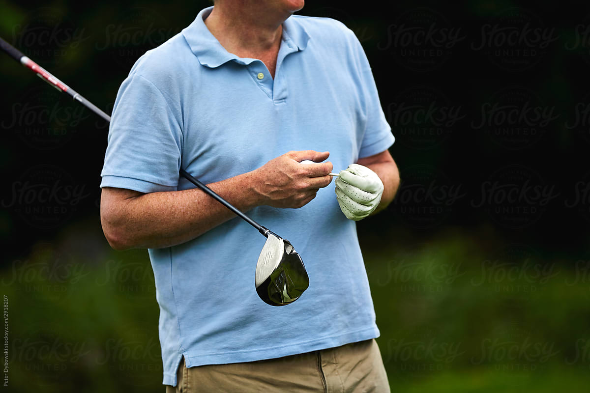 Man golfer getting ready to take a shot.
