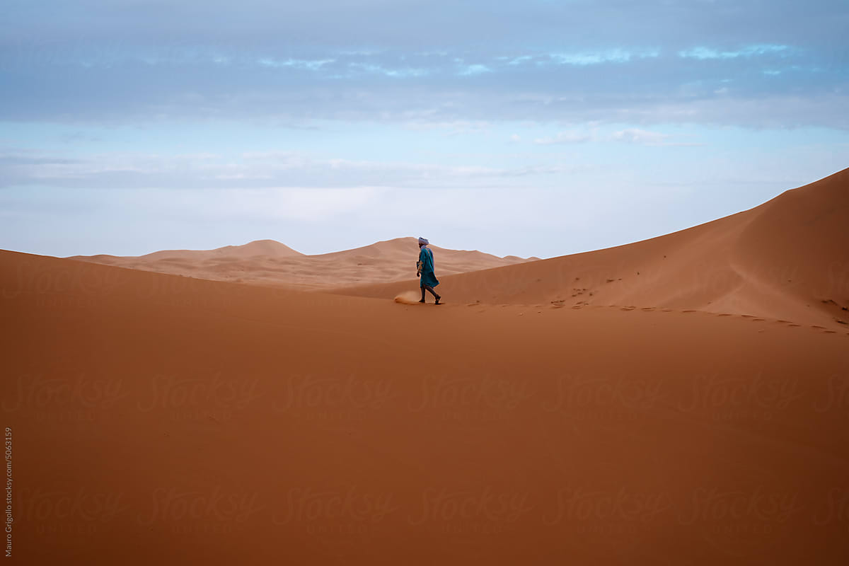 Man walking alone in the Desert