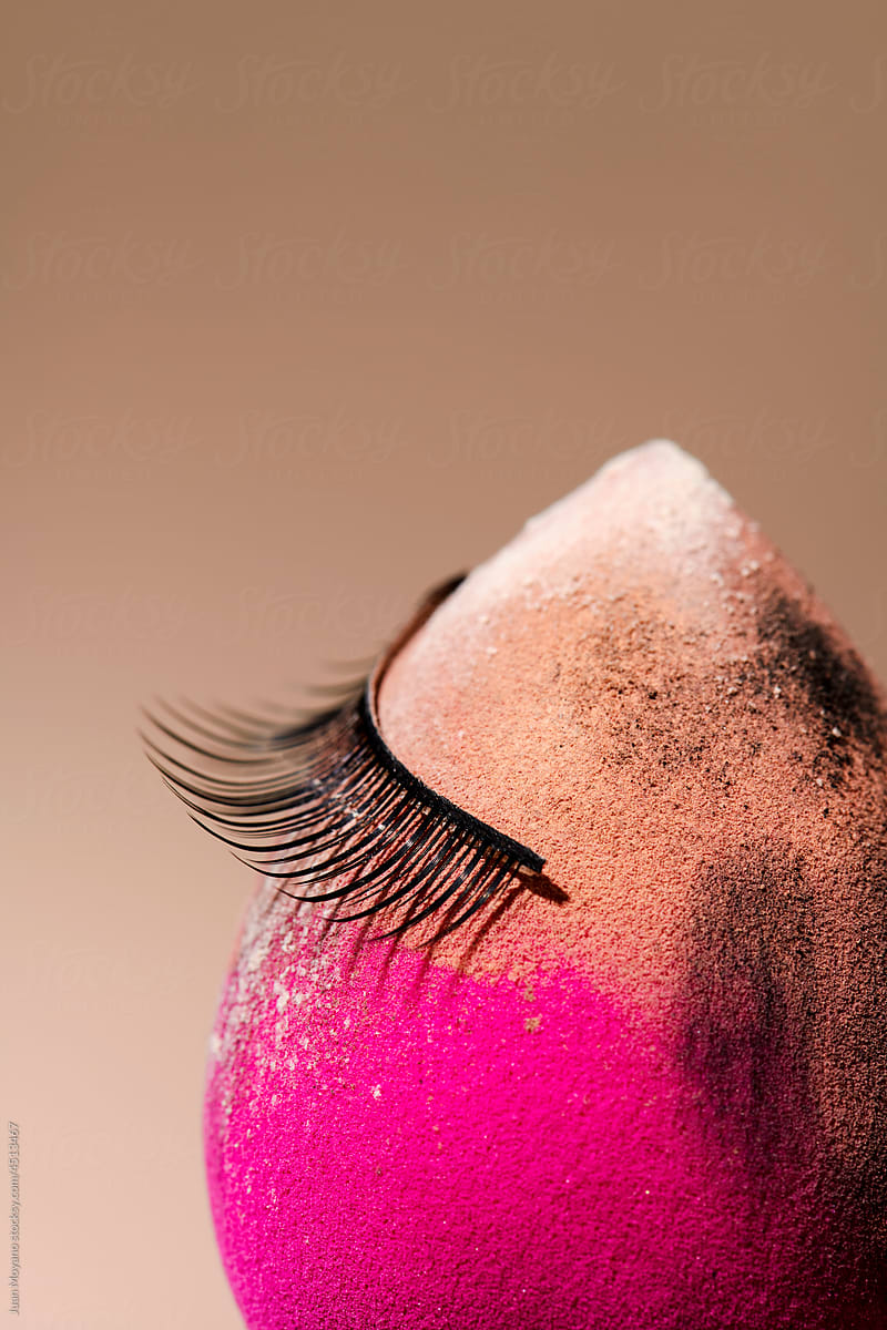 make-up sponge with a fake eyelash