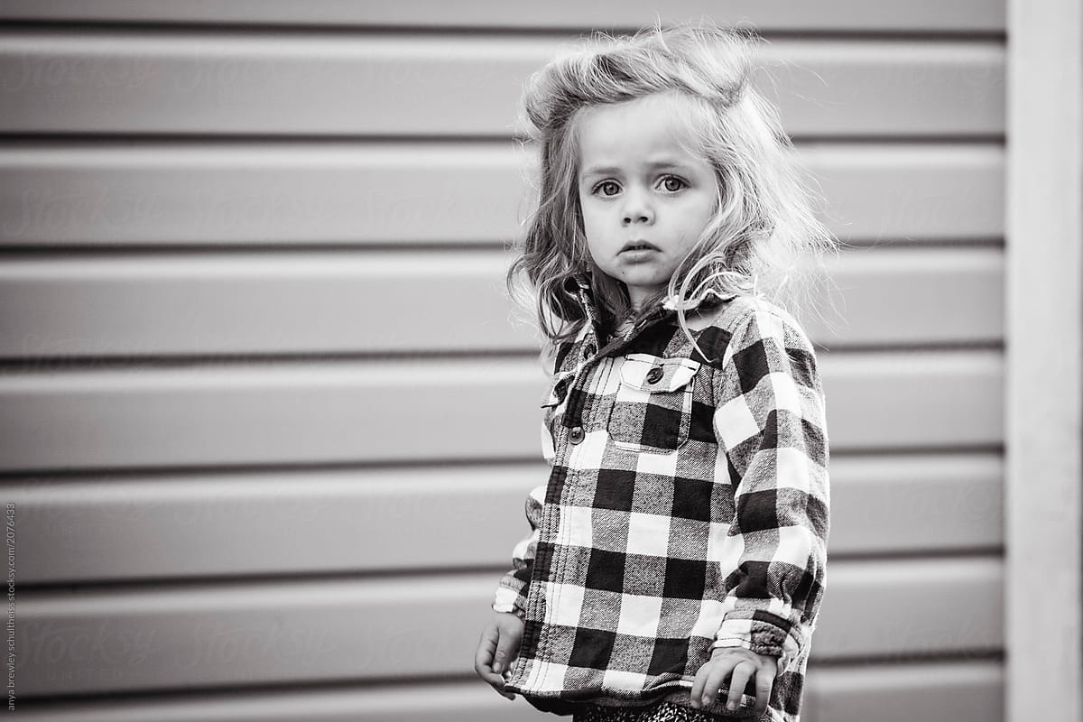 Toddler with long hair looking off into the distance