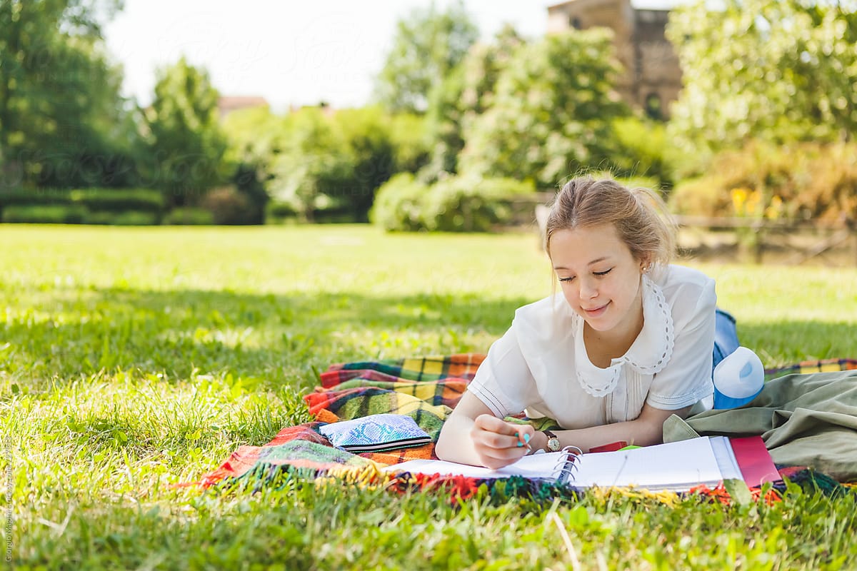 Teenage Girl Studying at the Park