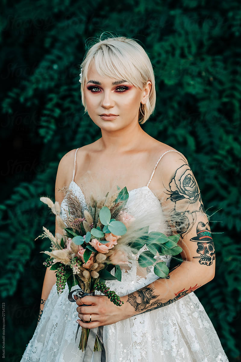 Portrait Of Young Blond Tattooed Bride