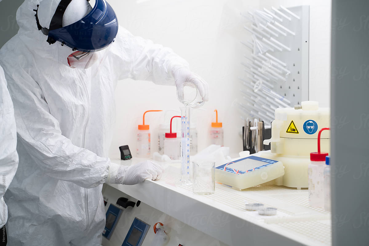 Researcher Working With Sample In Chamber At Clean Room