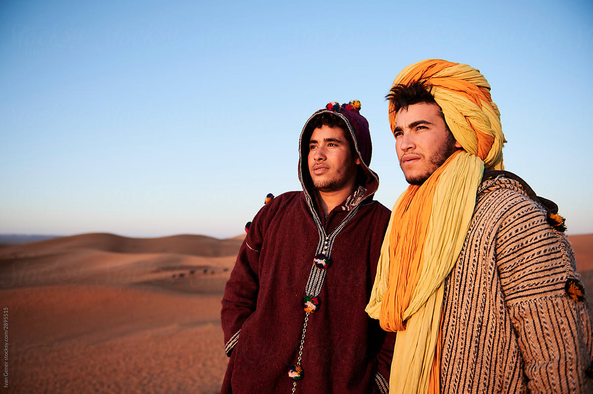 Berber tribe friends watch sunrise