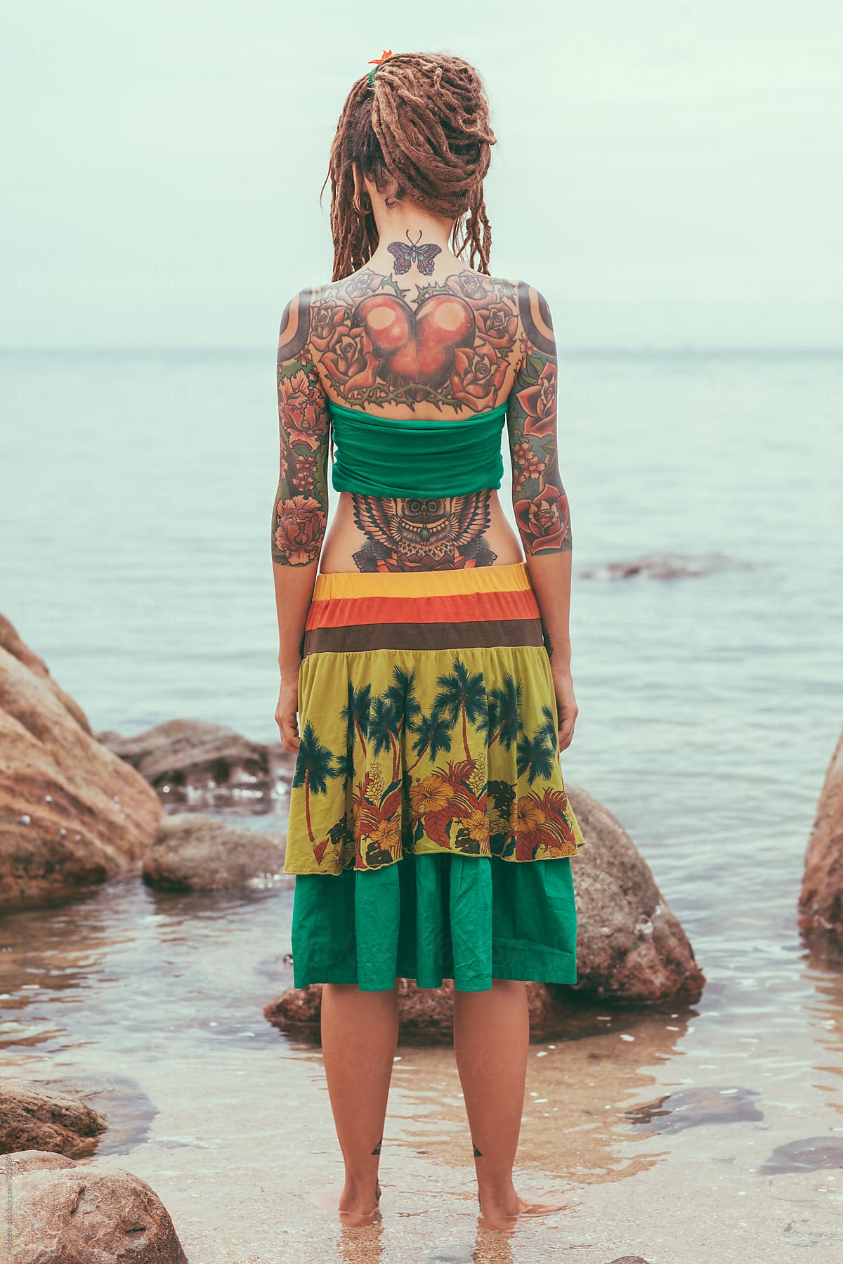 Tattooed Woman Standing at the Beach