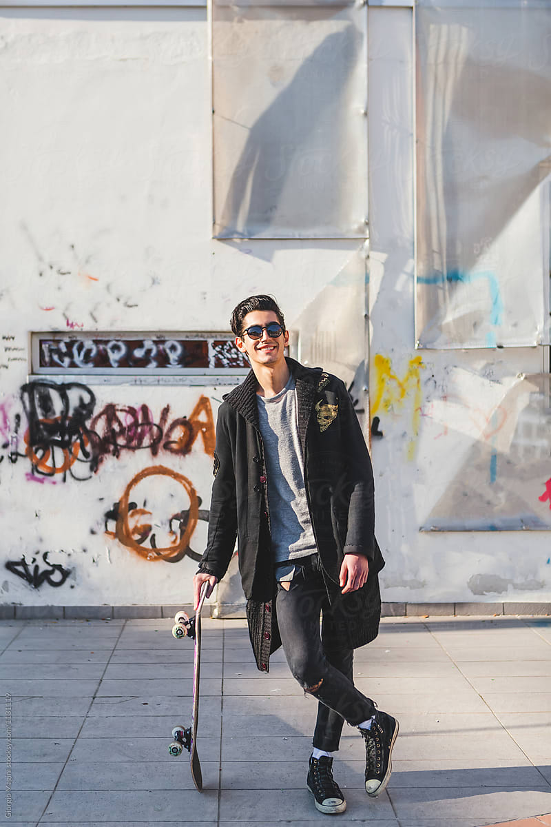 Smiling Skateboarder in Urban Area