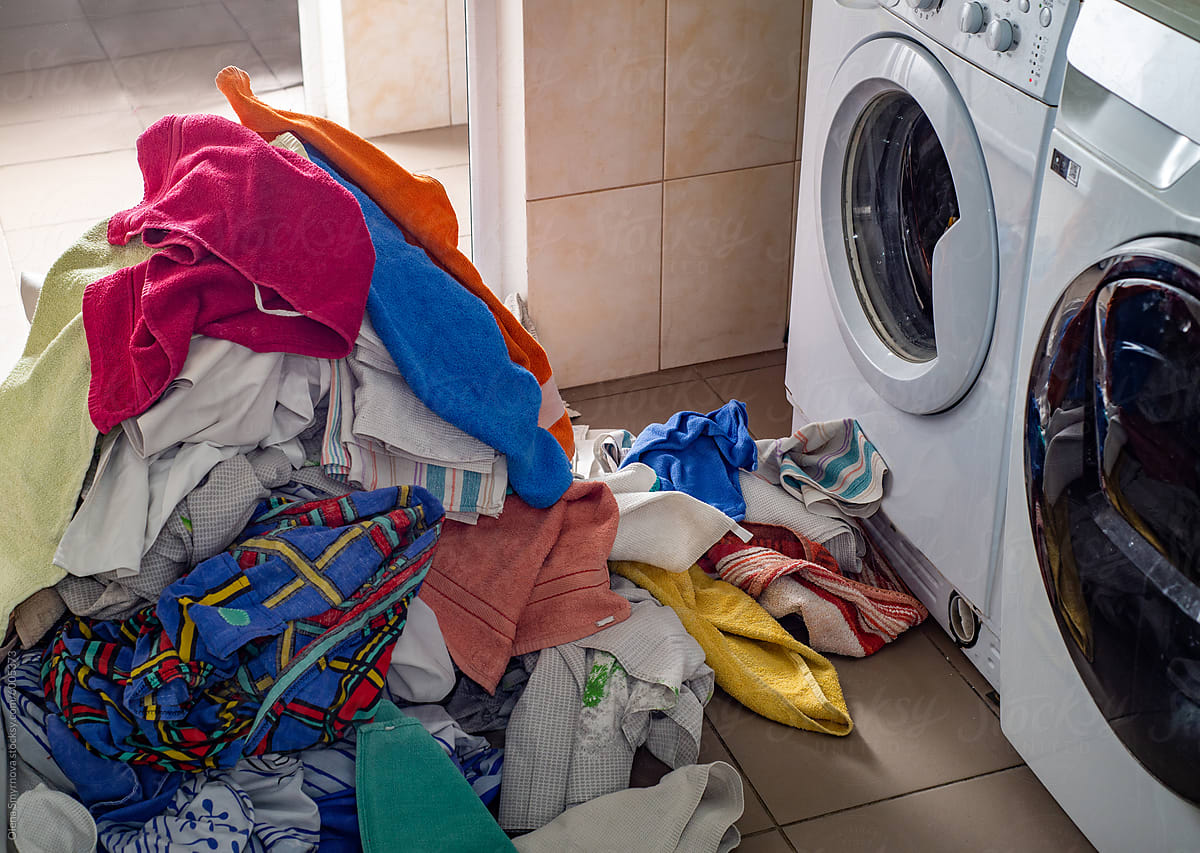 Heap of second hand laundry and washing machines
