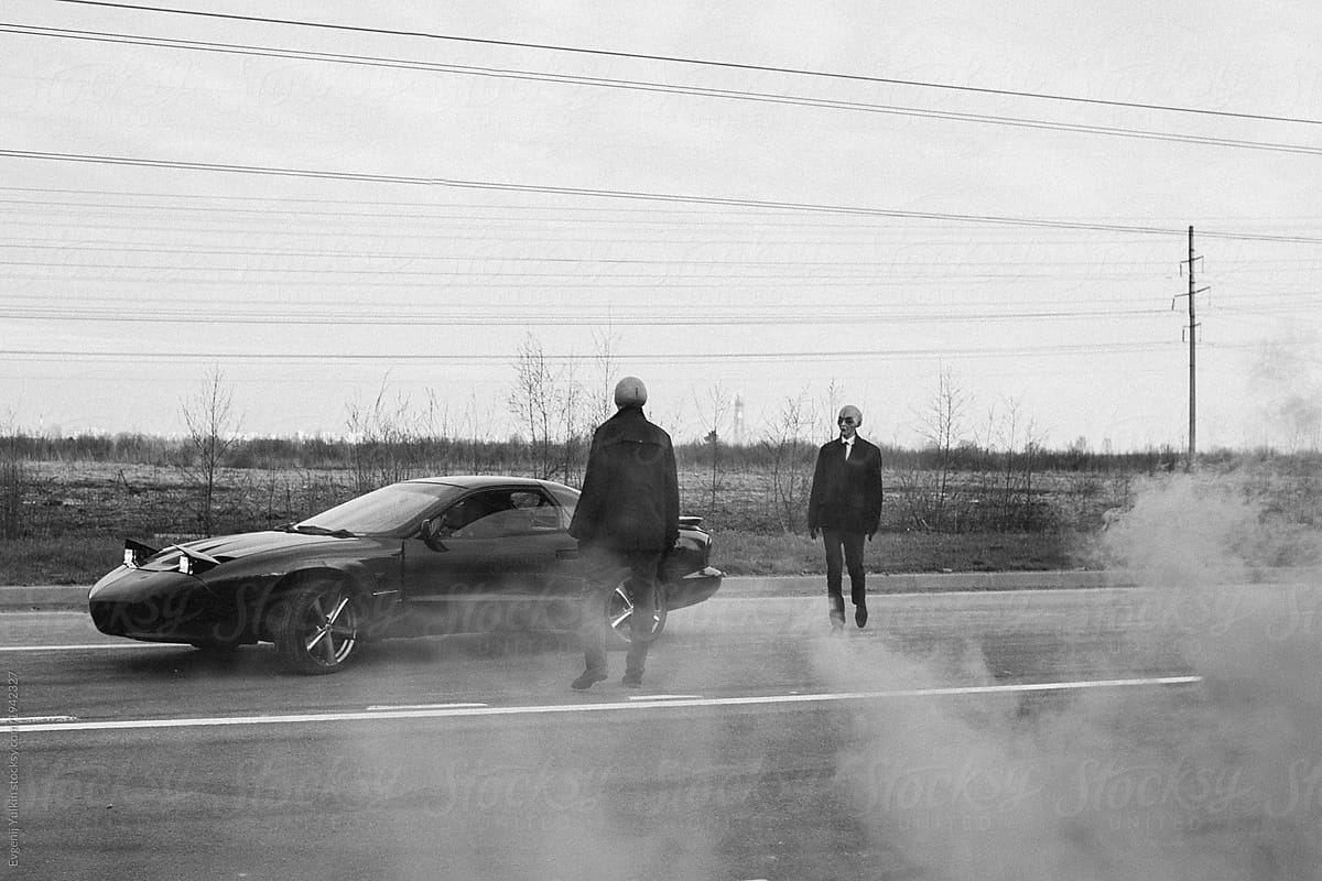 Aliens and a car on the abandoned road