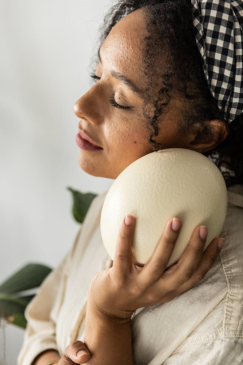 Peaceful woman with Ostrich egg