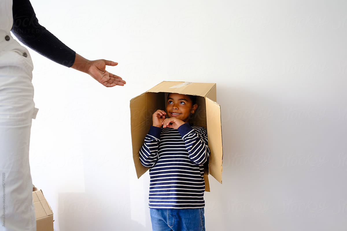 Happy Kid inside moving cardboard box
