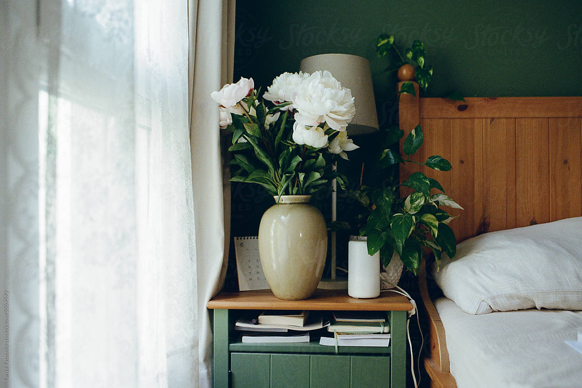 A Part View Of A Bedroom with green Wall
