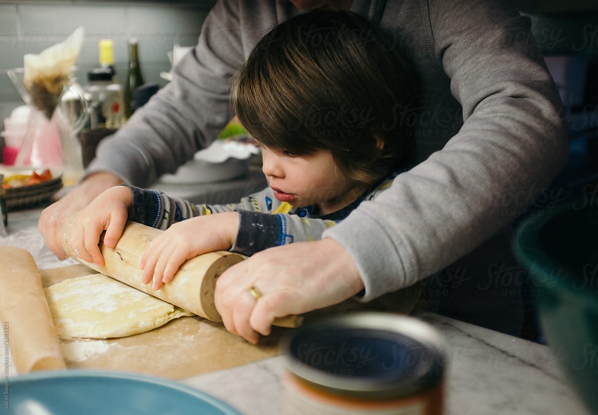 A child rolling a dough