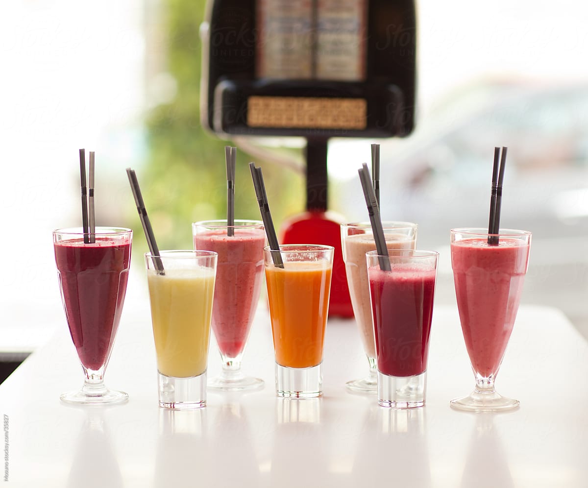 Bunch of colorful smoothies and shakes served in a restaurant.