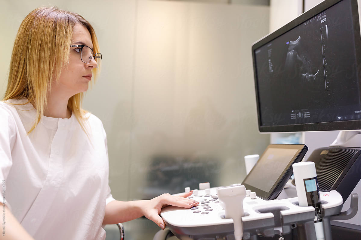Medical practitioner scanning ultrasound image