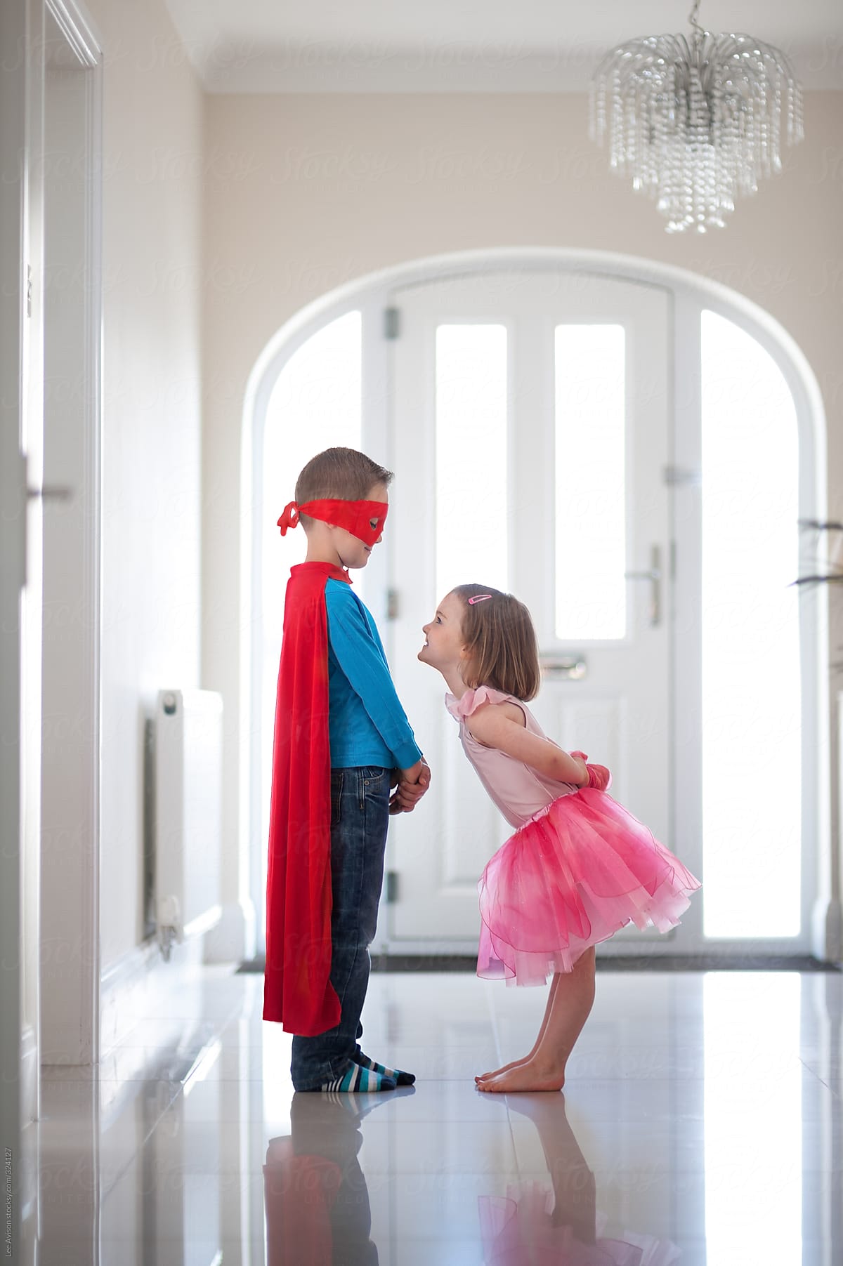 children dressing up and playing superhero and ballerina