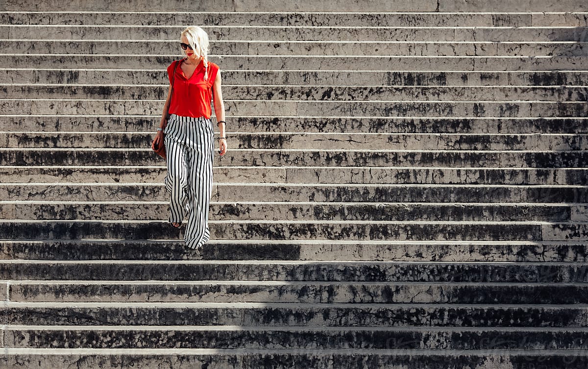 Woman Going Down The Stairs By Stocksy Contributor Lumina Stocksy