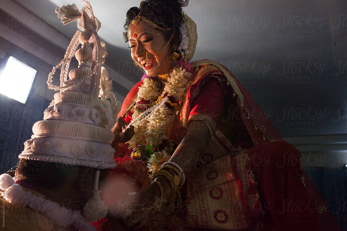 Bride and Groom making fun in a Hindu traditional marriage ceremony