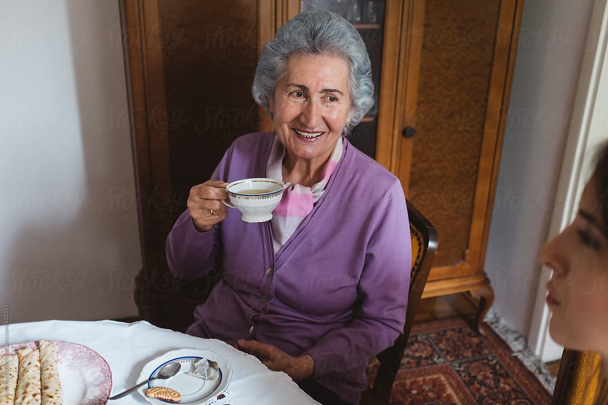 Beautiful Grandma Drinking Tea by Katarina Radovic - Stocksy United
