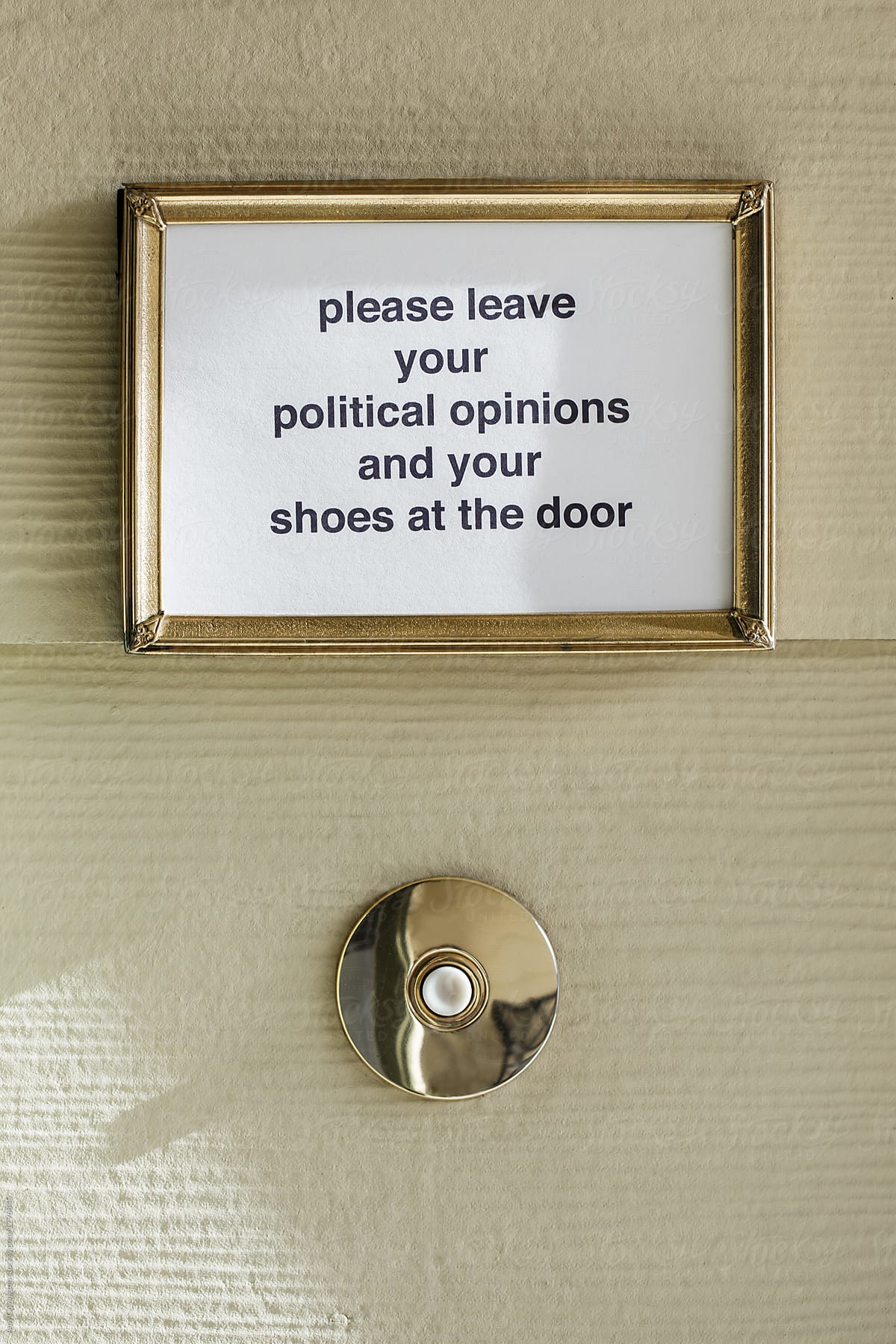 A political sign above a doorbell