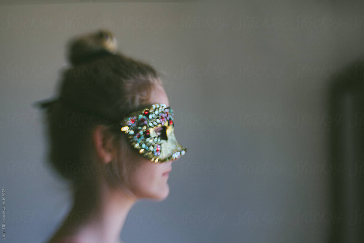 Side profile of girl wearing a mask