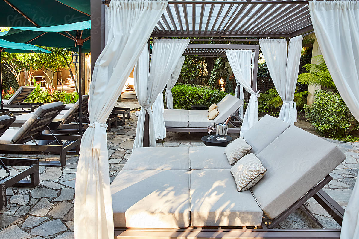Luxury cabanas on patio with champagne at luxury hotel