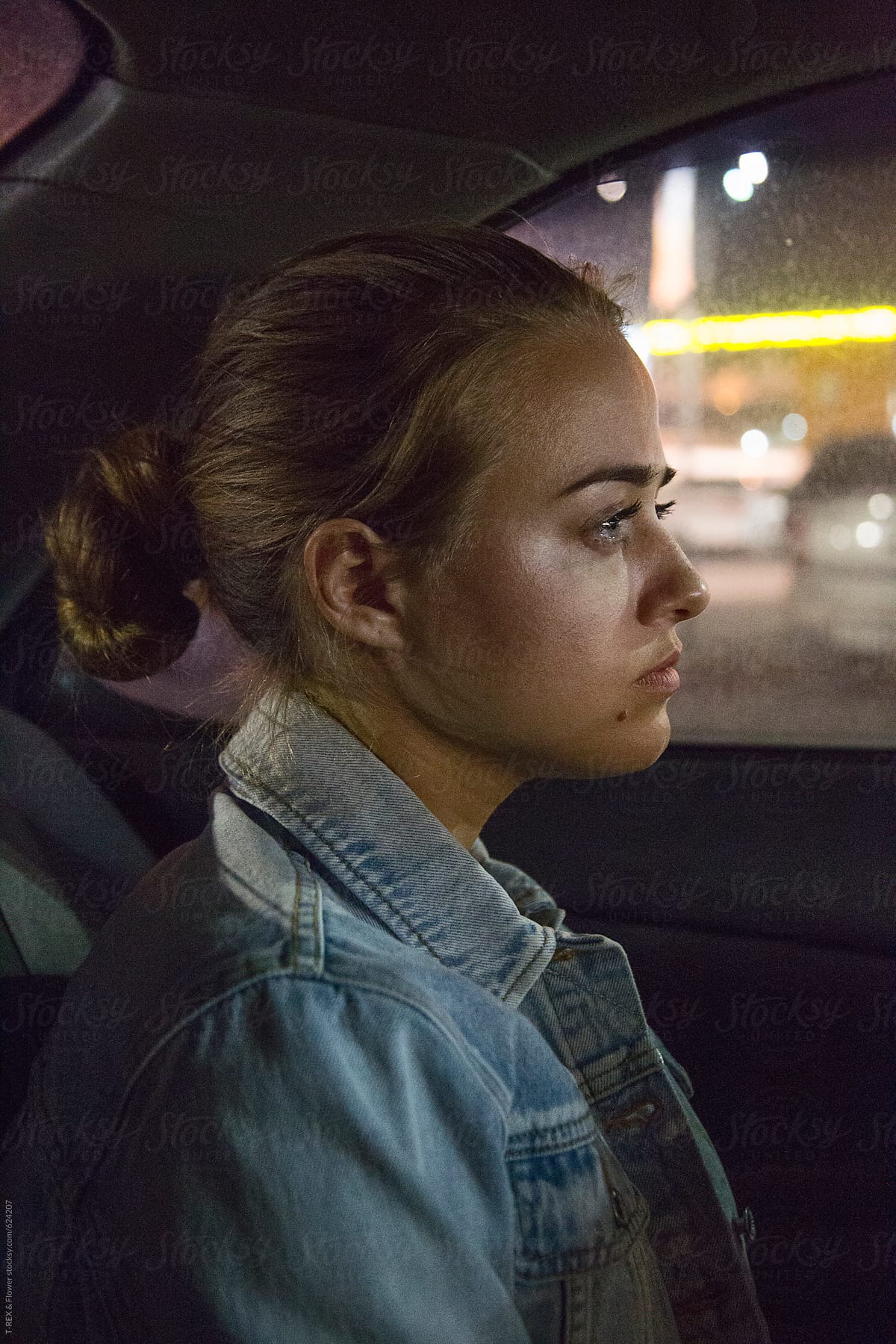 Concerned lonely woman in car at night time