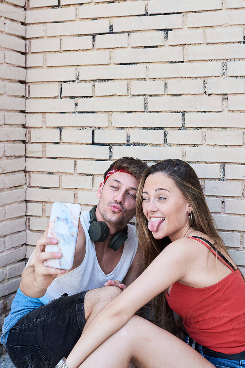 Lovely couple taking selfies