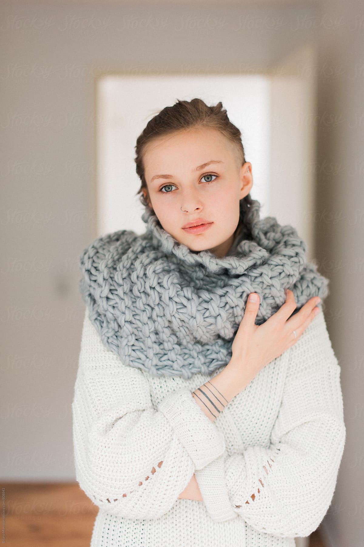 Young Woman Wearing Scarf & Sweater