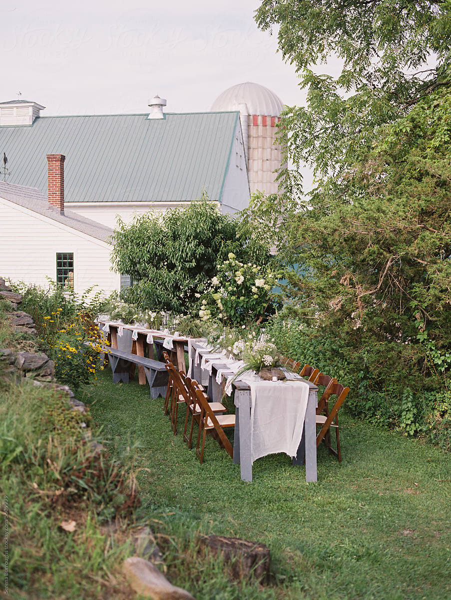 dinner event set up with long table and chairs at a dairy farm