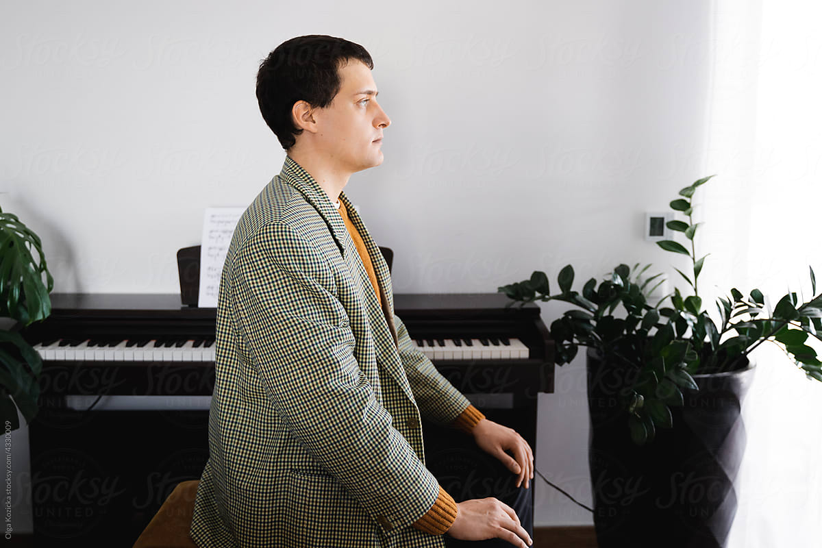 Musician Sitting By Piano