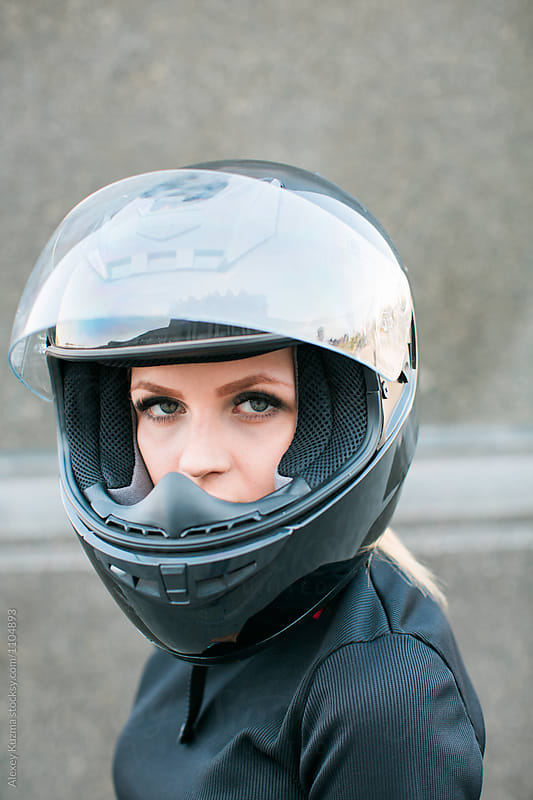 young woman in a motorcycle helmet