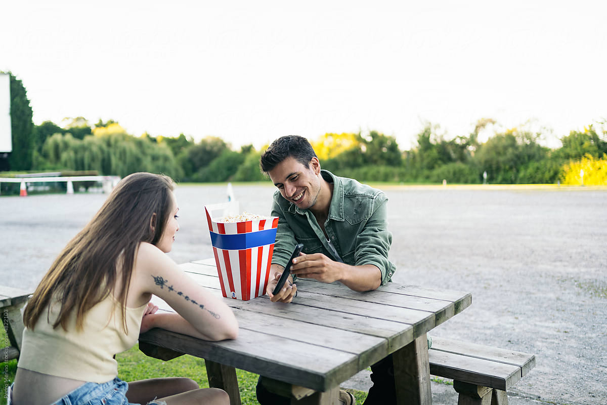 Couple dating at an outdoor drive-in movie
