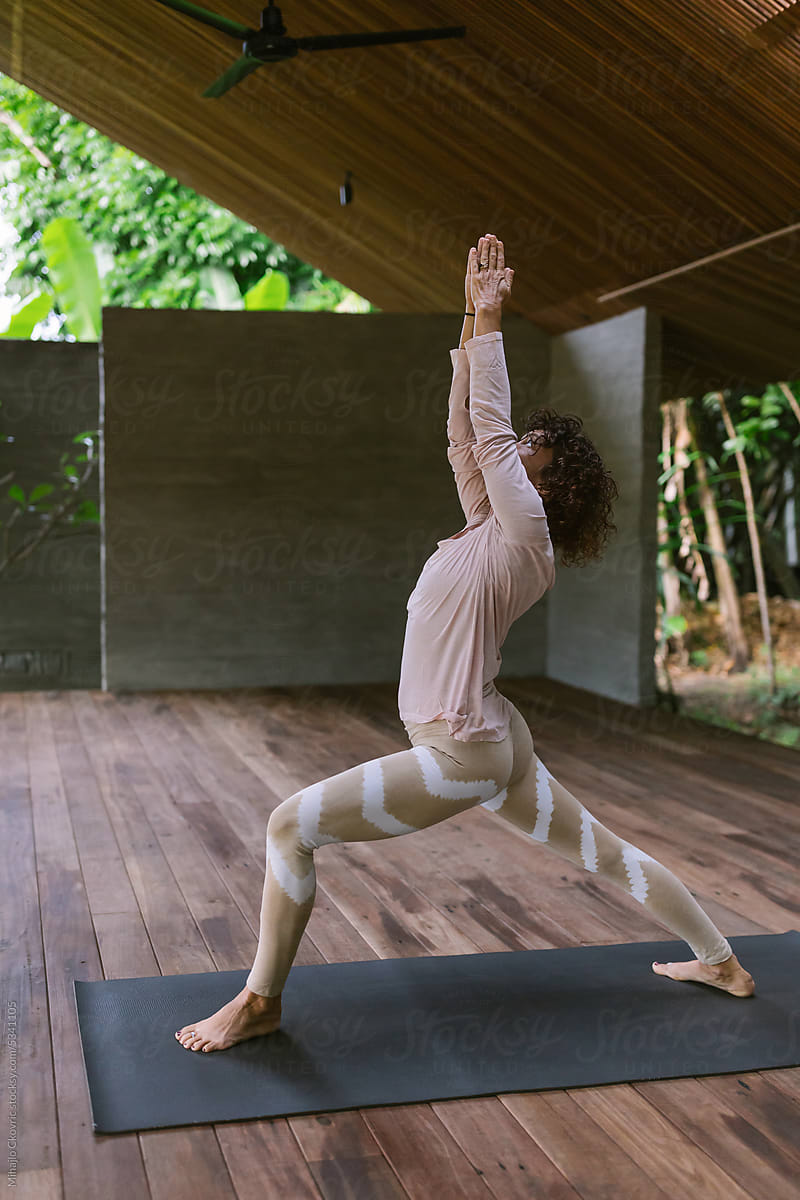Adult woman doing yoga in yoga studio