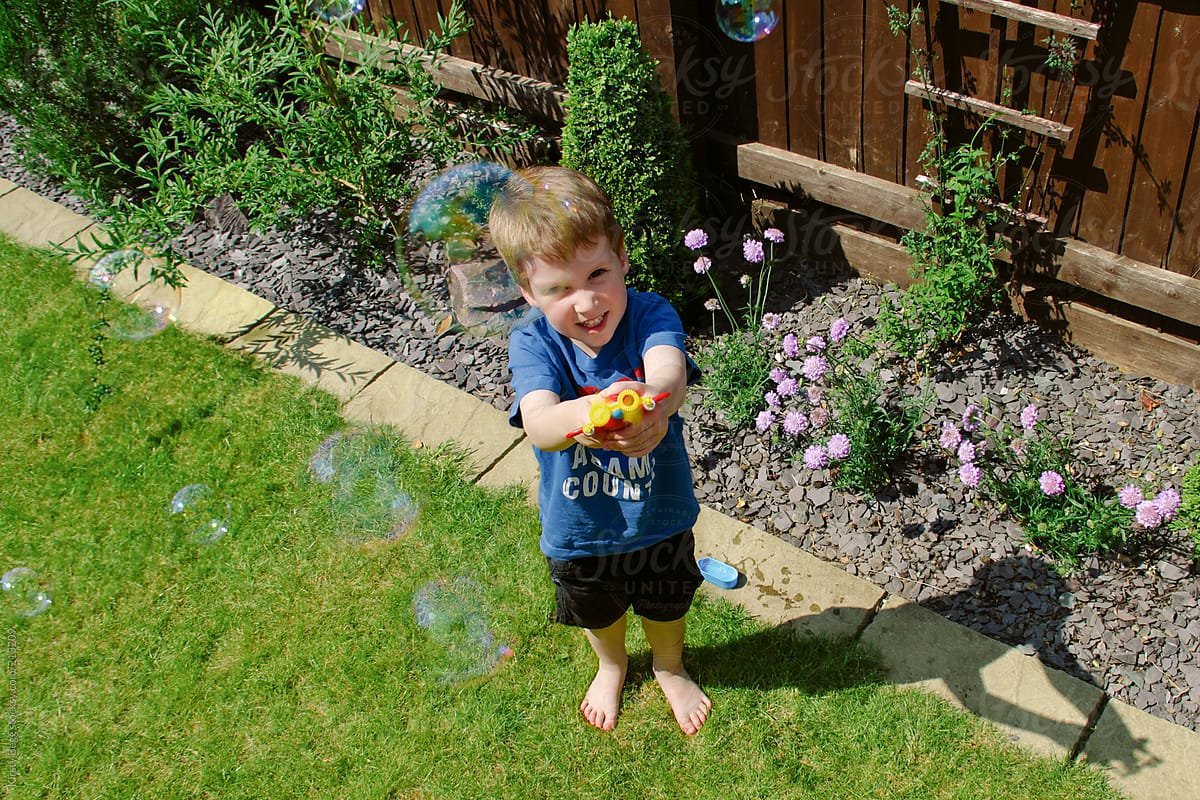 Boy plays with bubbles