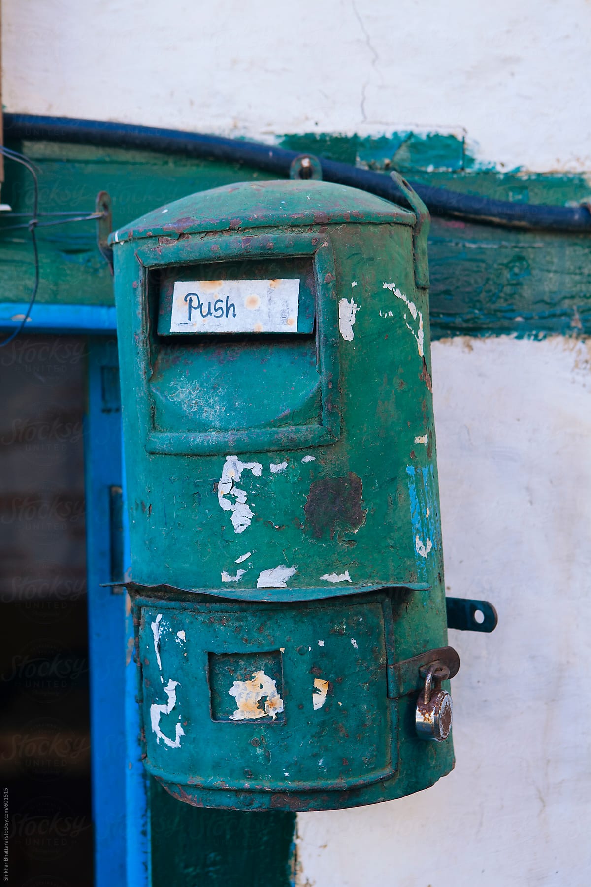 An old metal green letter box.