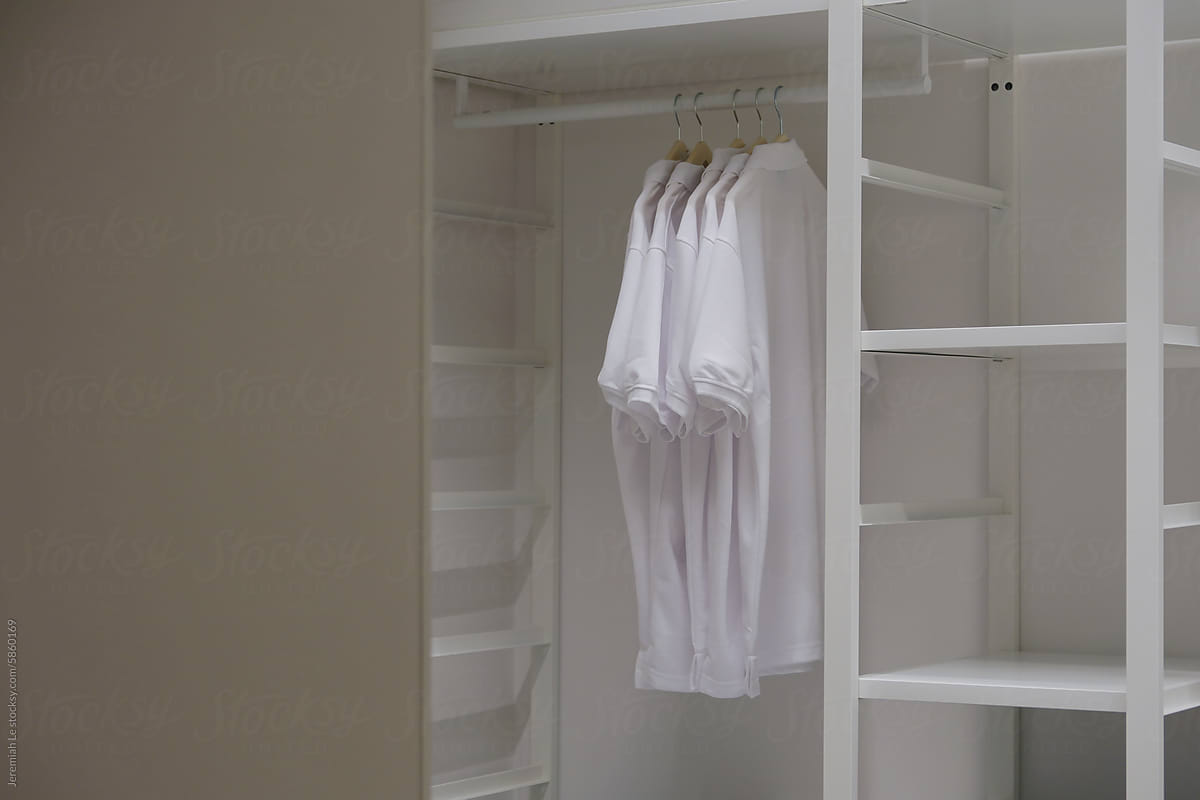 Minimal all white tshirts in the clothes rack