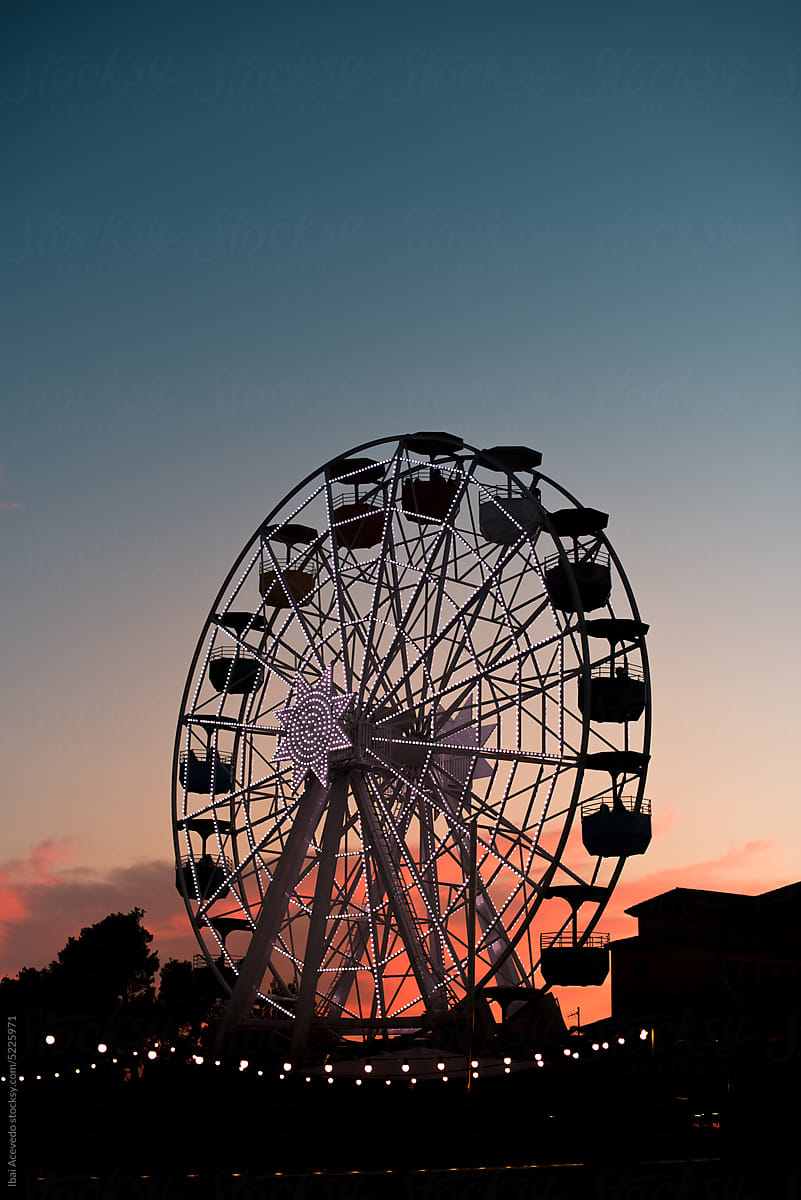 Ferris wheel silhouette at theme park