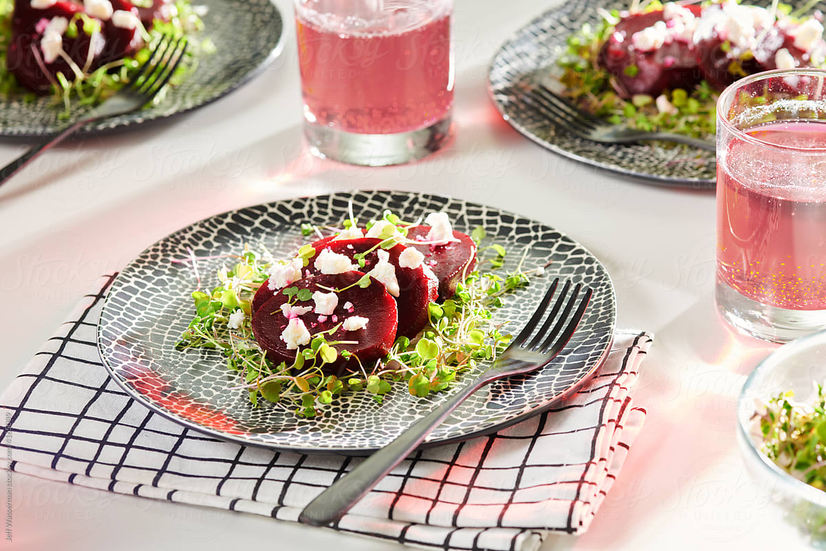 Side View of Beetroot Salad on Plate with Sodas