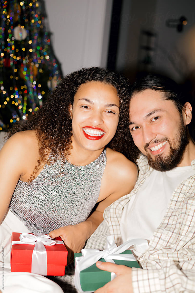 portrait of a man and a woman in love near the Christmas tree