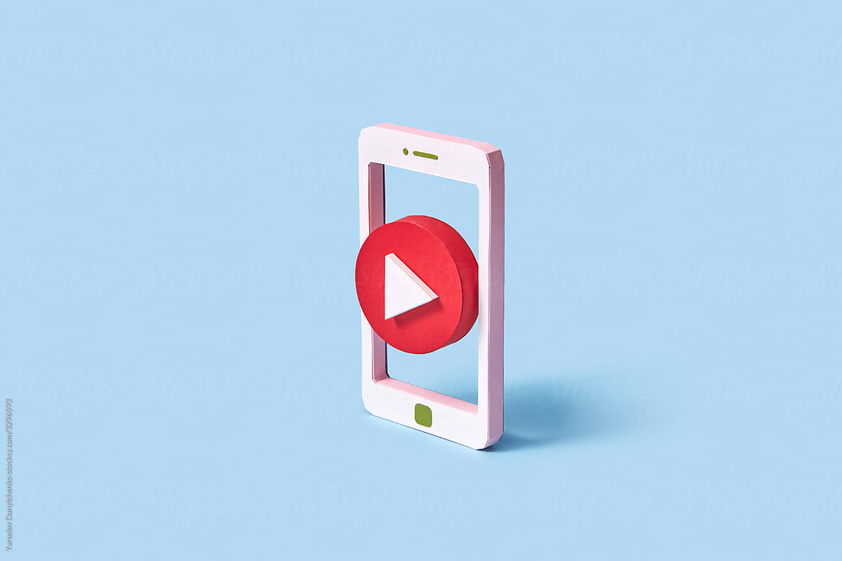 Papercraft red button play in smartphone frame.