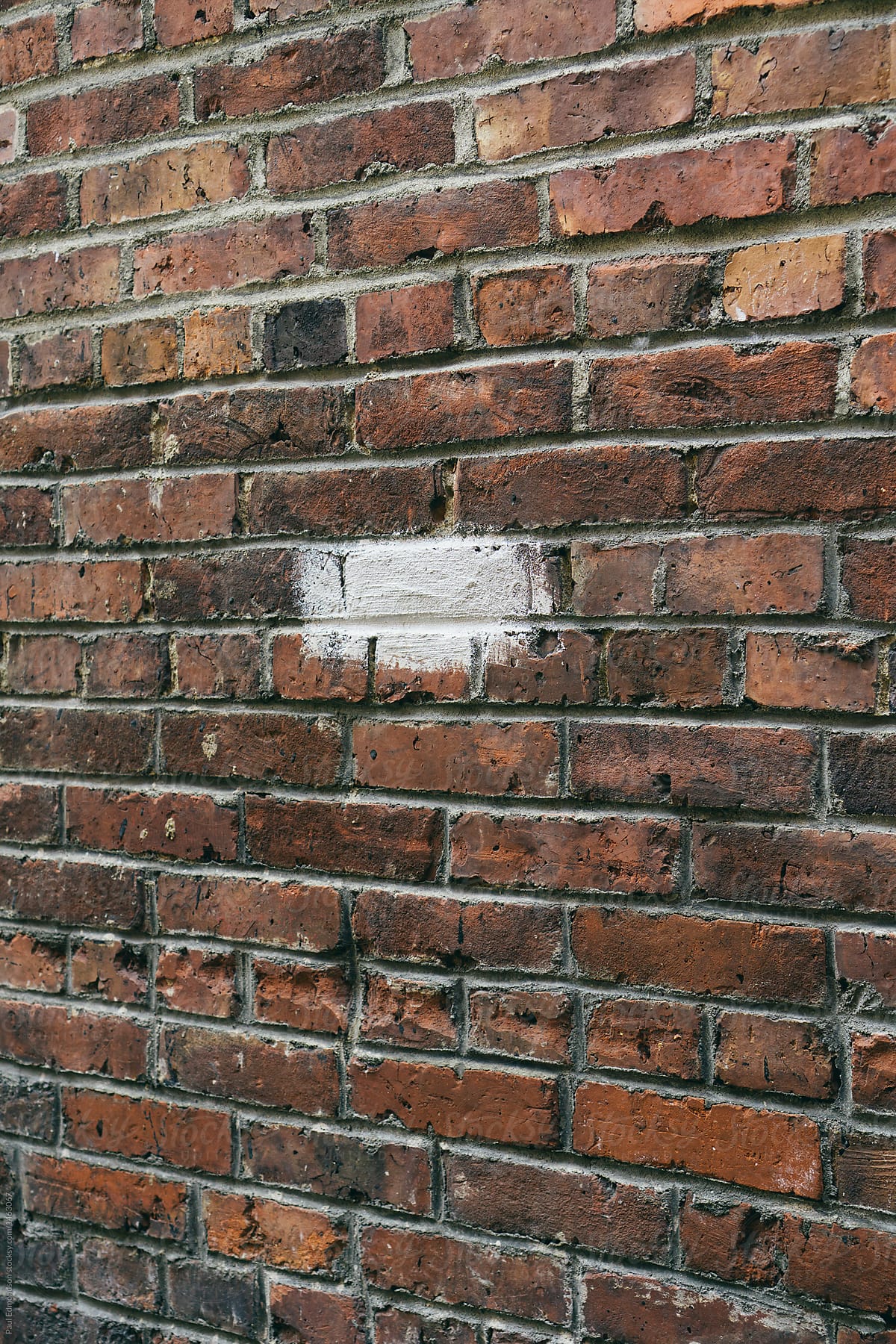 Painted silver brick on building wall