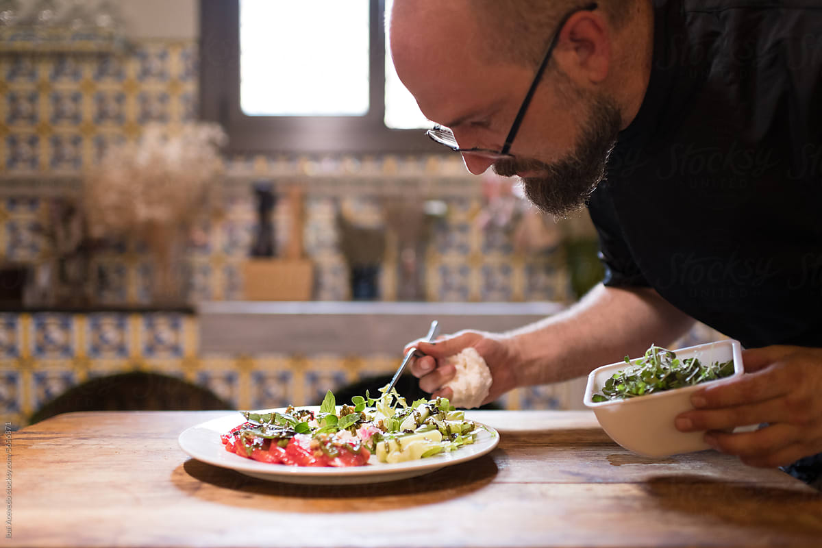 Passionate chef preparing healthy salad