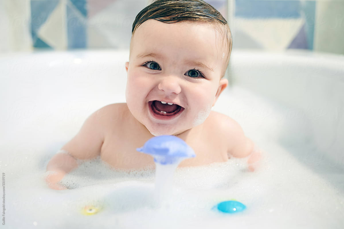 Happy baby bathing