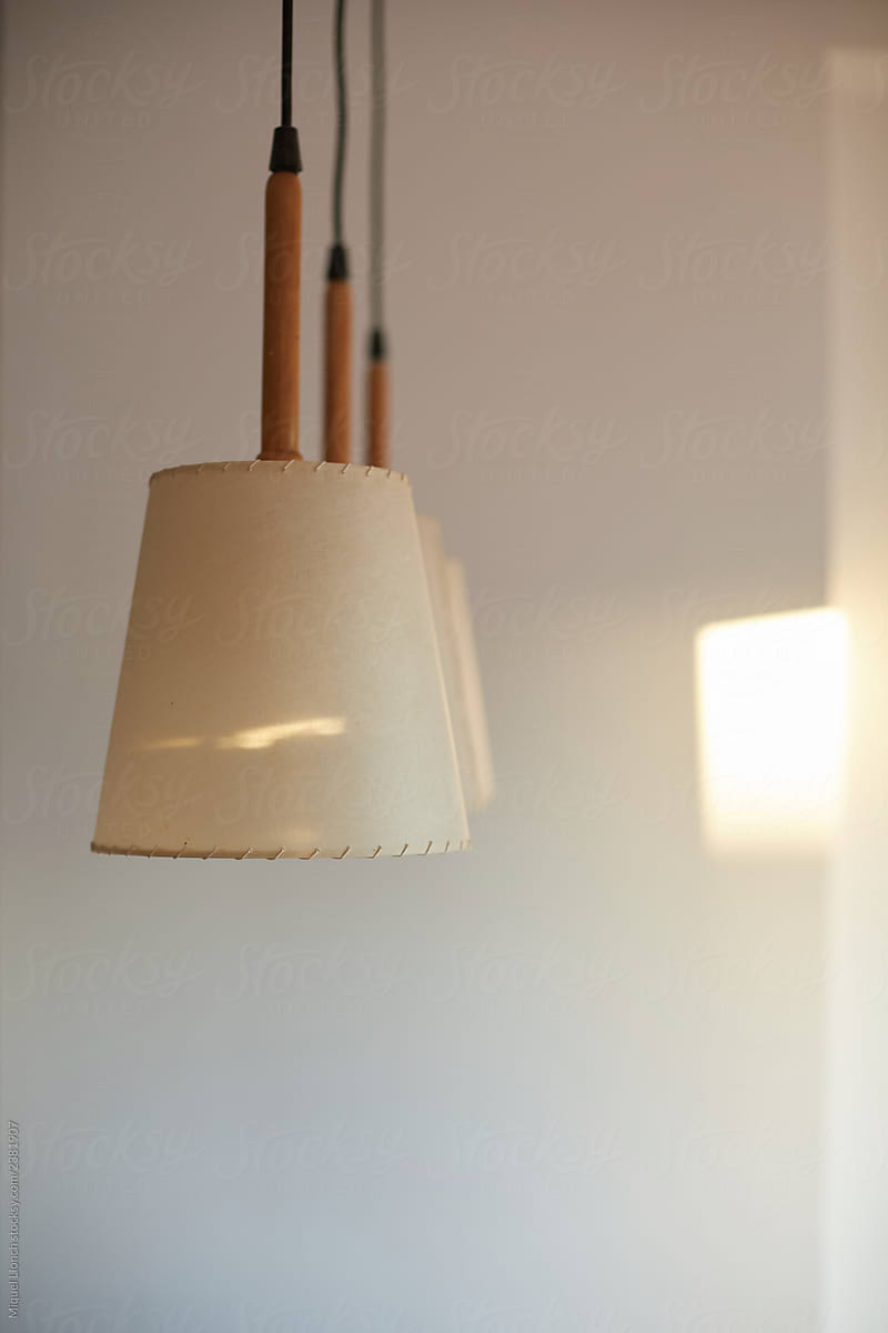 Hanging lamps and indoors white wall