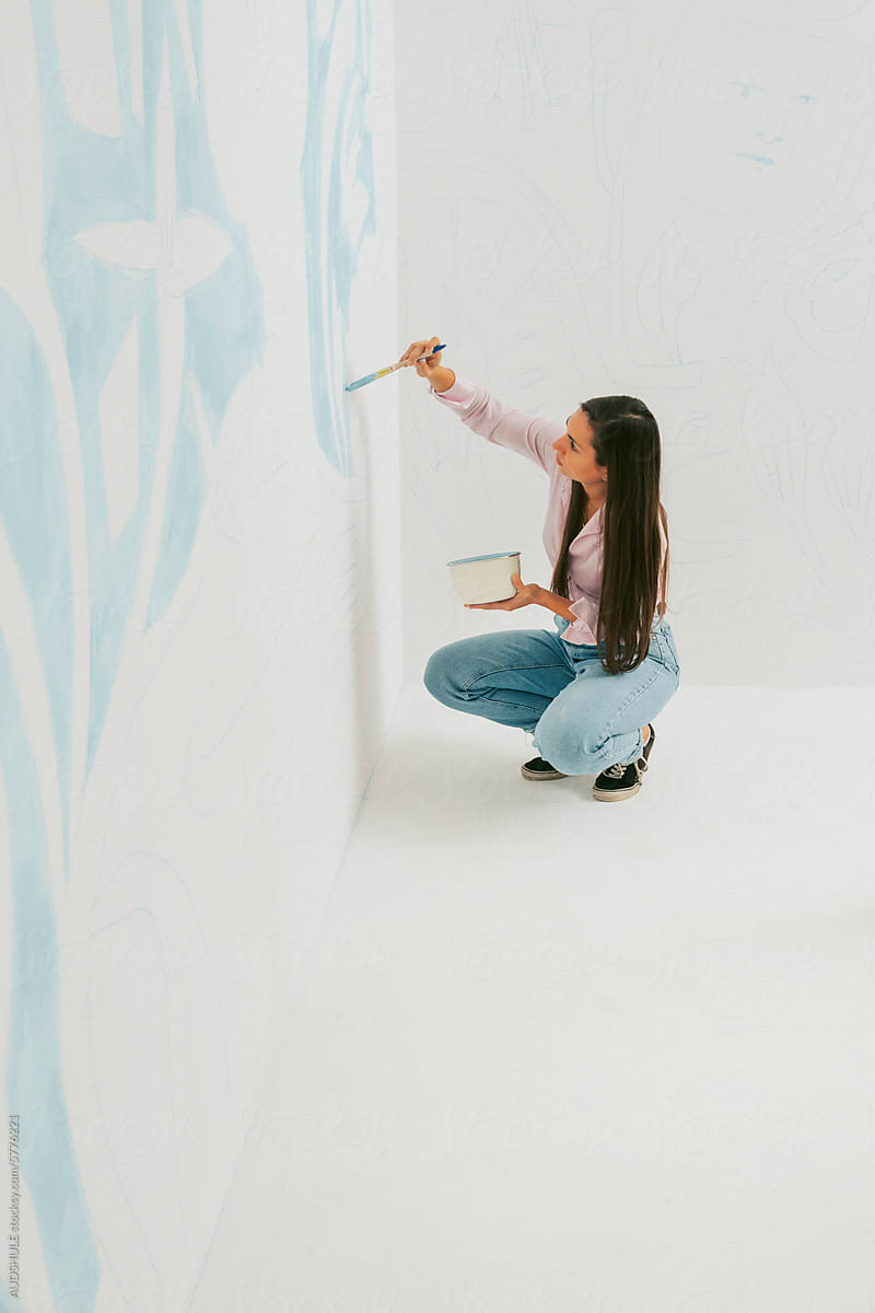 Painter painting wall paint.